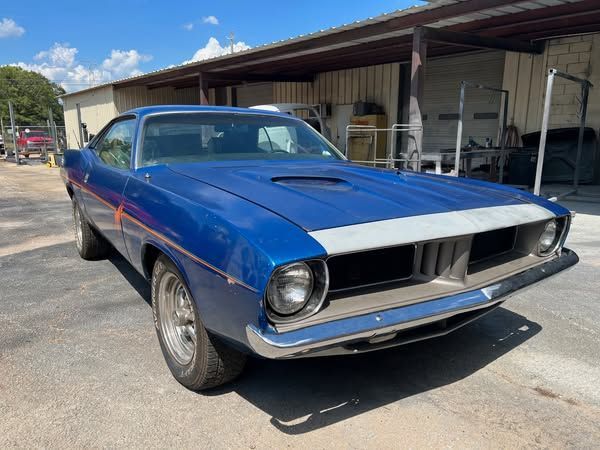 1973 Plymouth Barracuda, featuring a classic design and eye-catching details.