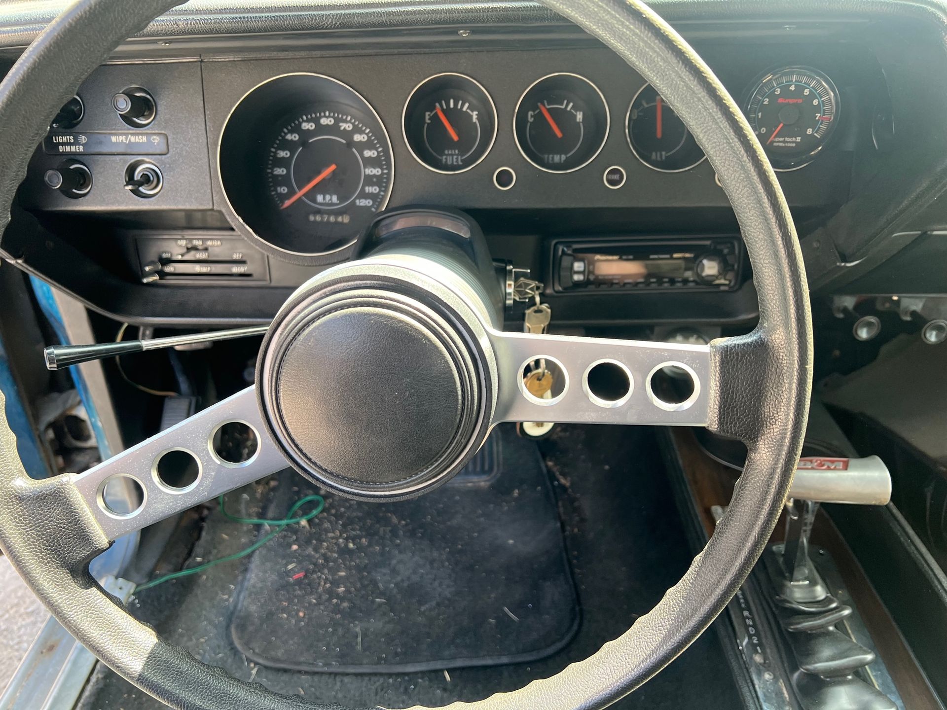 A close up of a steering wheel of 1973 Plymouth Barracuda car.