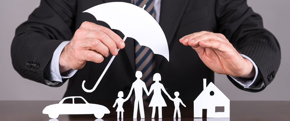 Man holding an umbrella protecting a family, a house and a car