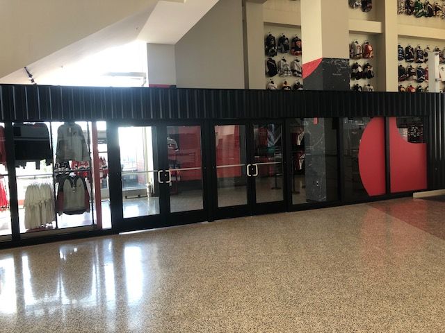 A store with a red circle on the side of it