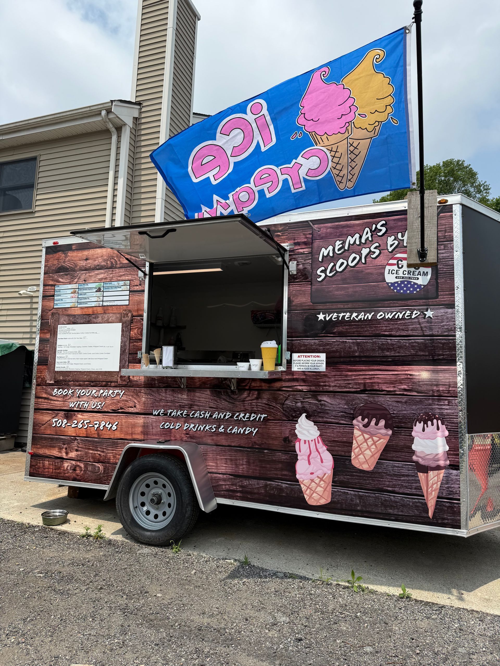 Three bags of sand are sitting on top of a wooden table.