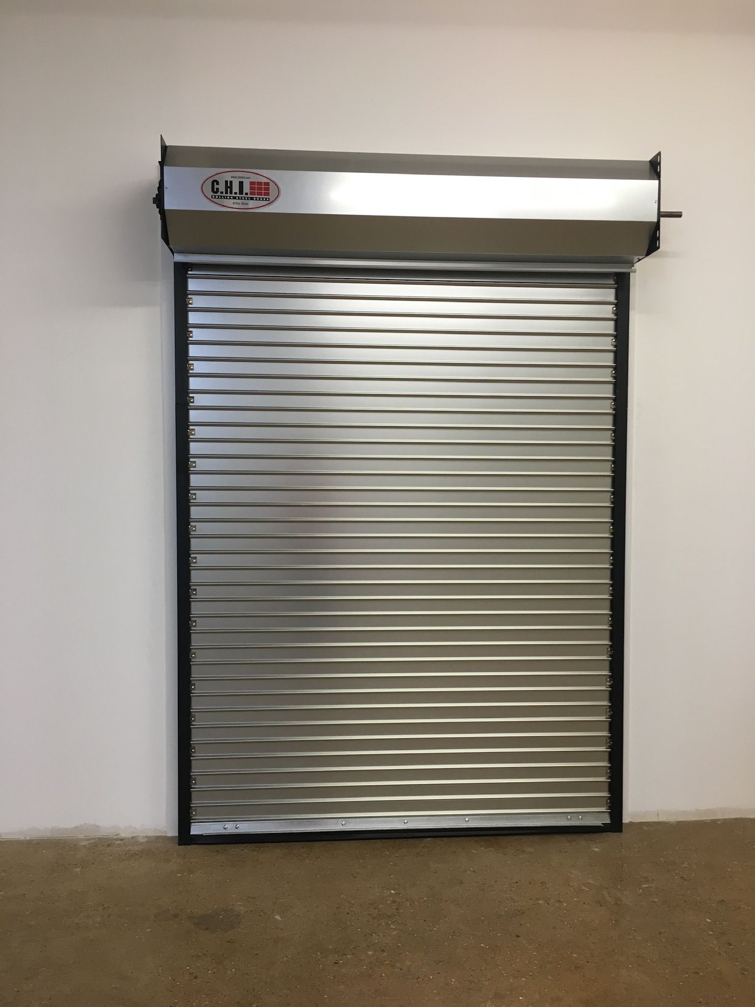 A wooden fence with trees in the background and a house in the background