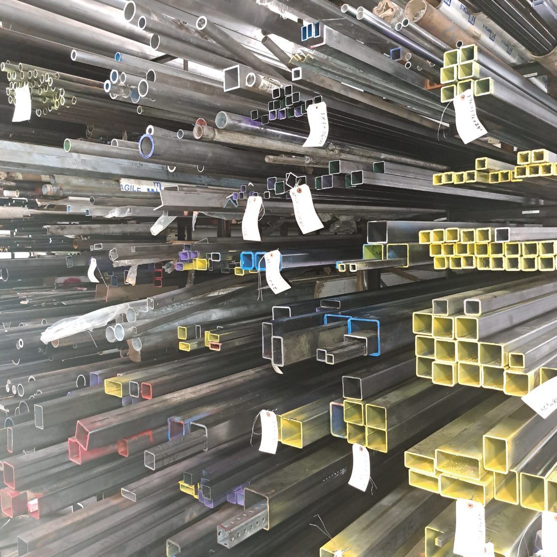 A bunch of metal pipes are stacked on top of each other