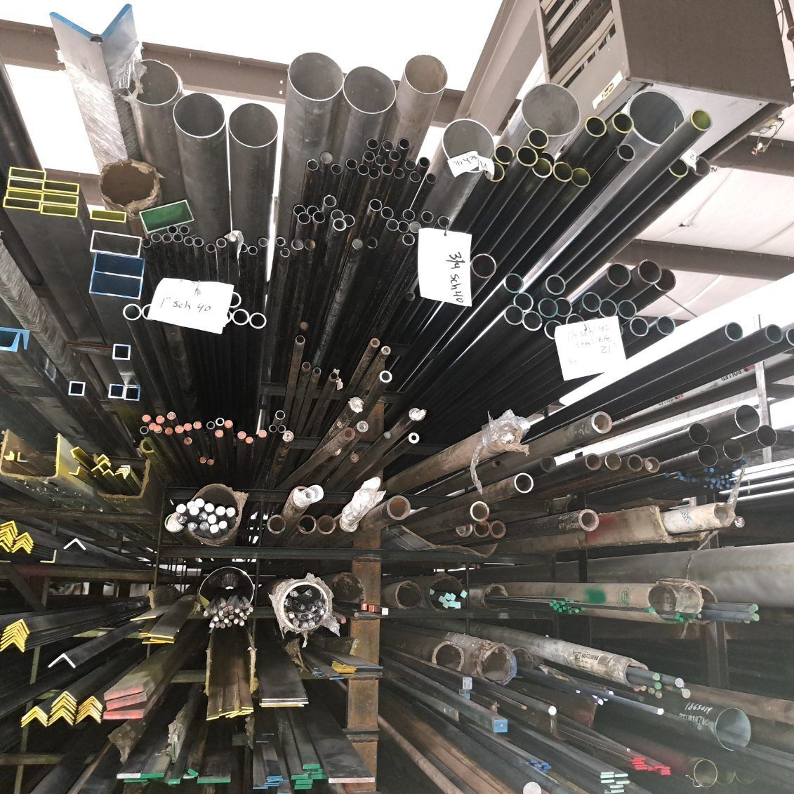 A bunch of metal pipes are stacked on top of each other