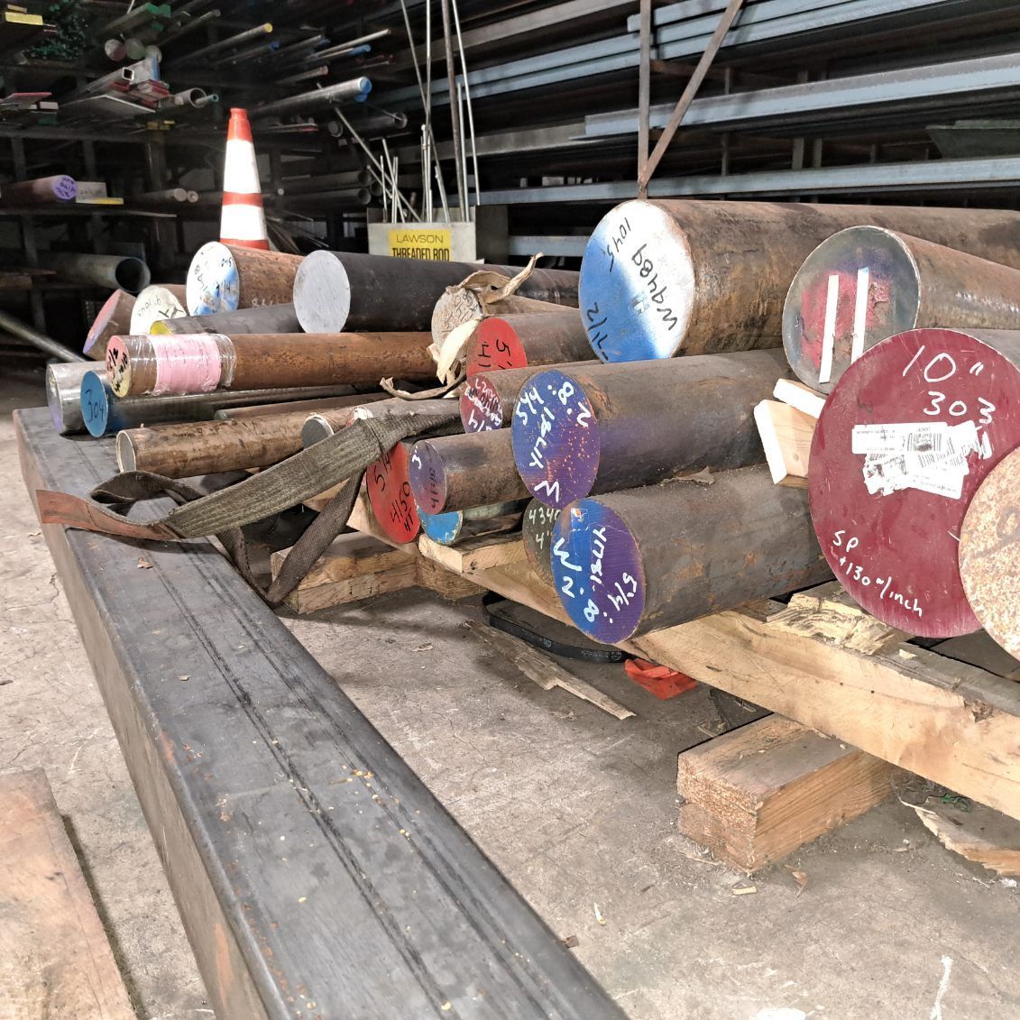 A bunch of metal rods are stacked on top of each other on a table.