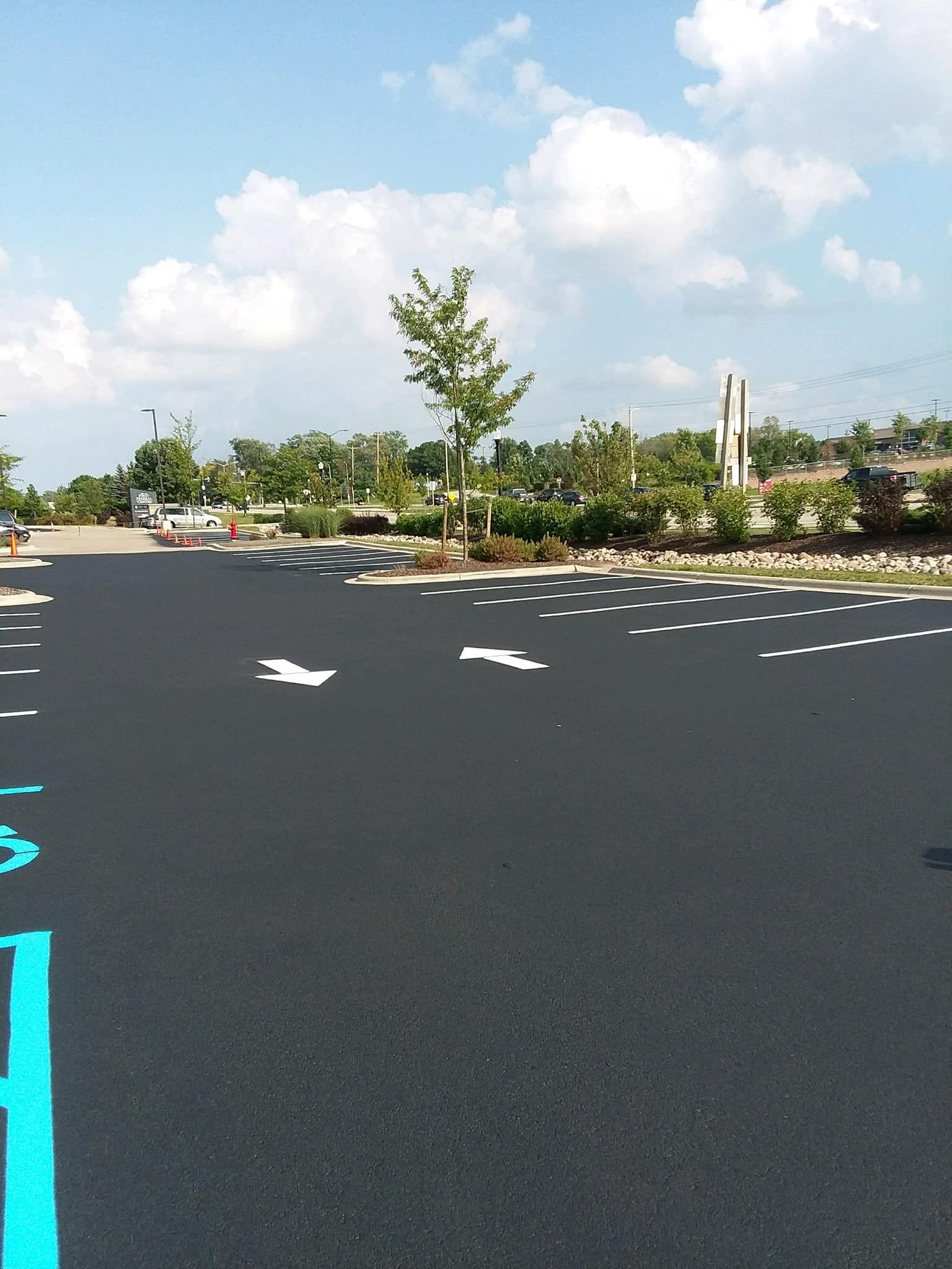 A parking lot with a handicapped parking sign painted on it