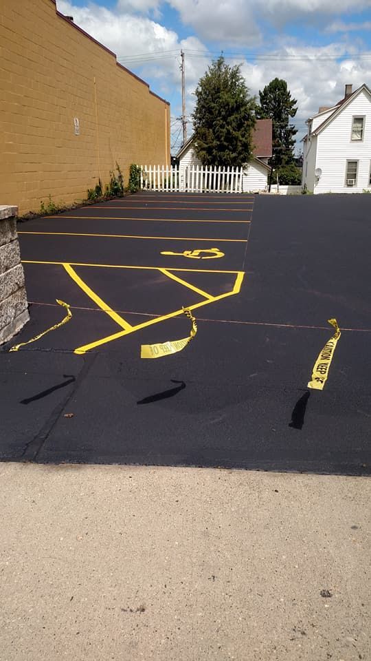 A parking lot with yellow lines painted on it.