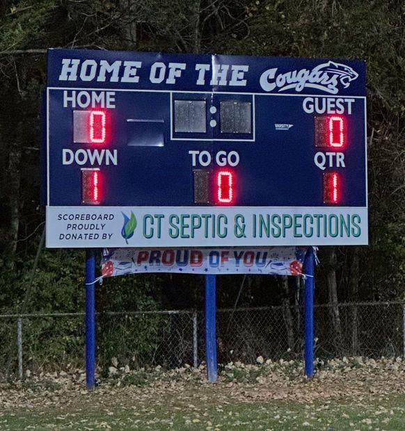 Football scoreboard showing Home of the Cougars, Home 0, Guest 0, 1st quarter, sponsor ad below.