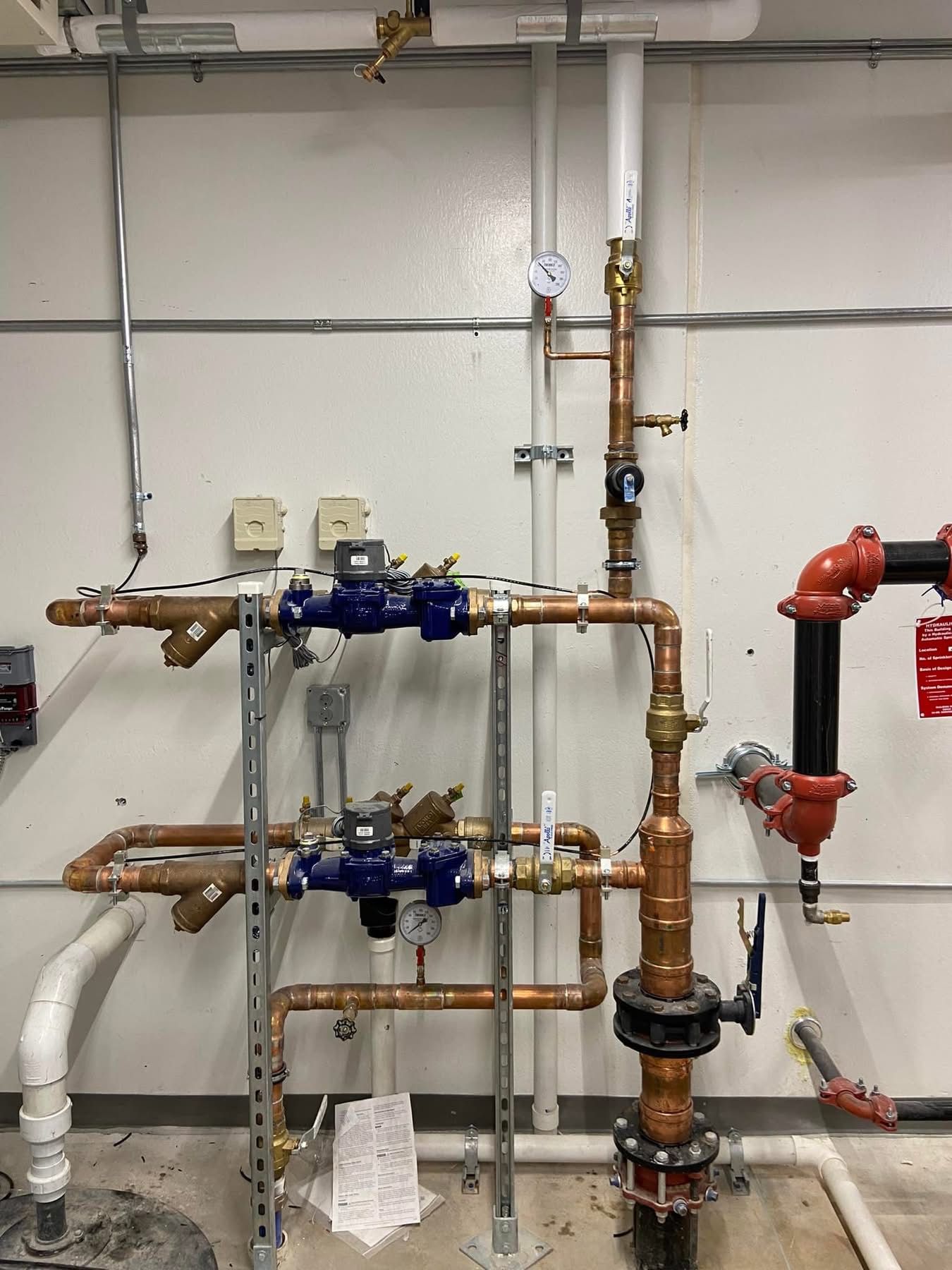 A bunch of pipes are connected to each other in a room.