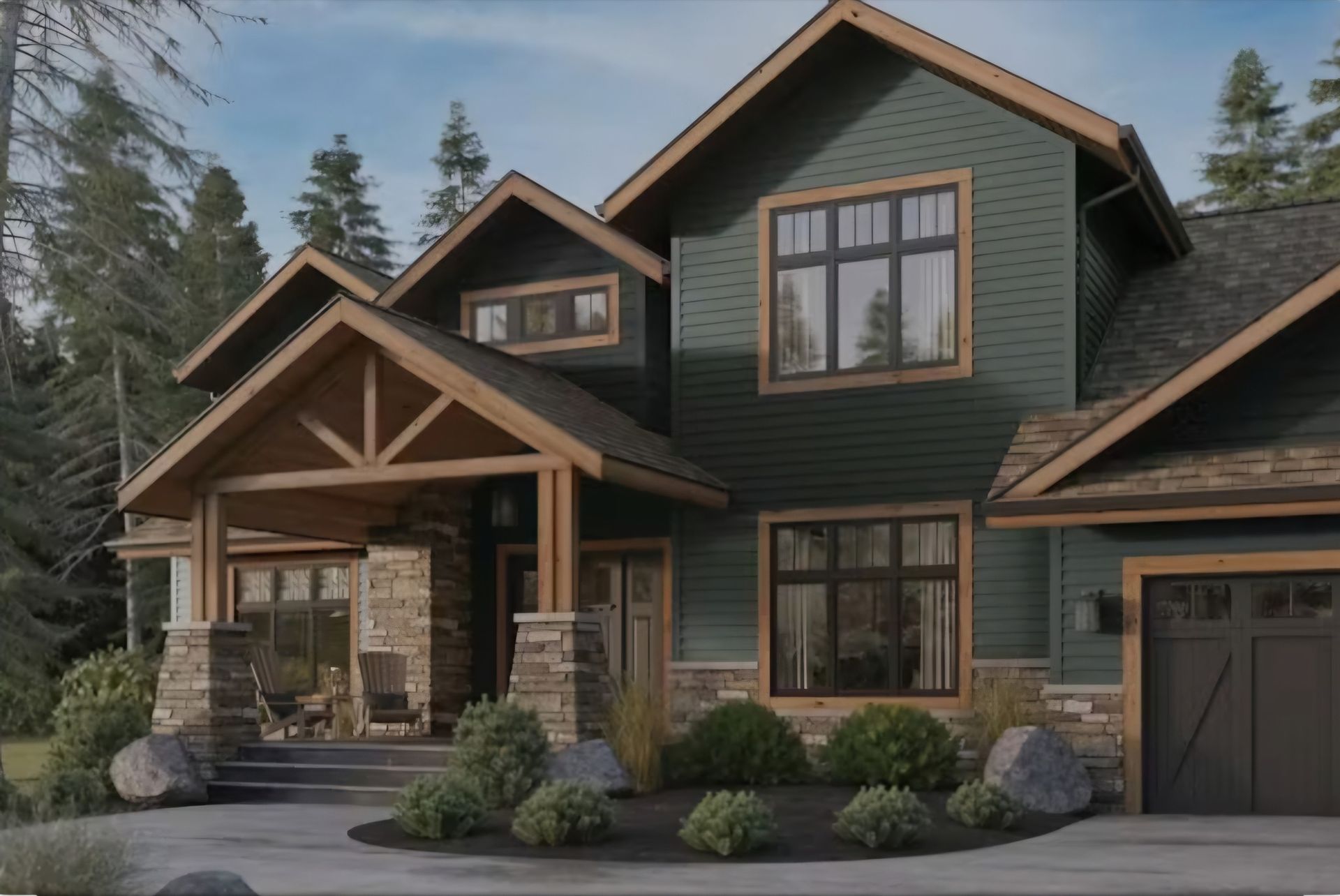 Green house with stone accents, brown trim, and a porch, set in a natural landscape.