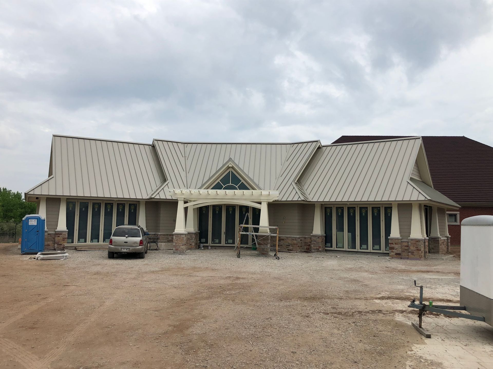 A large house with a car parked in front of it
