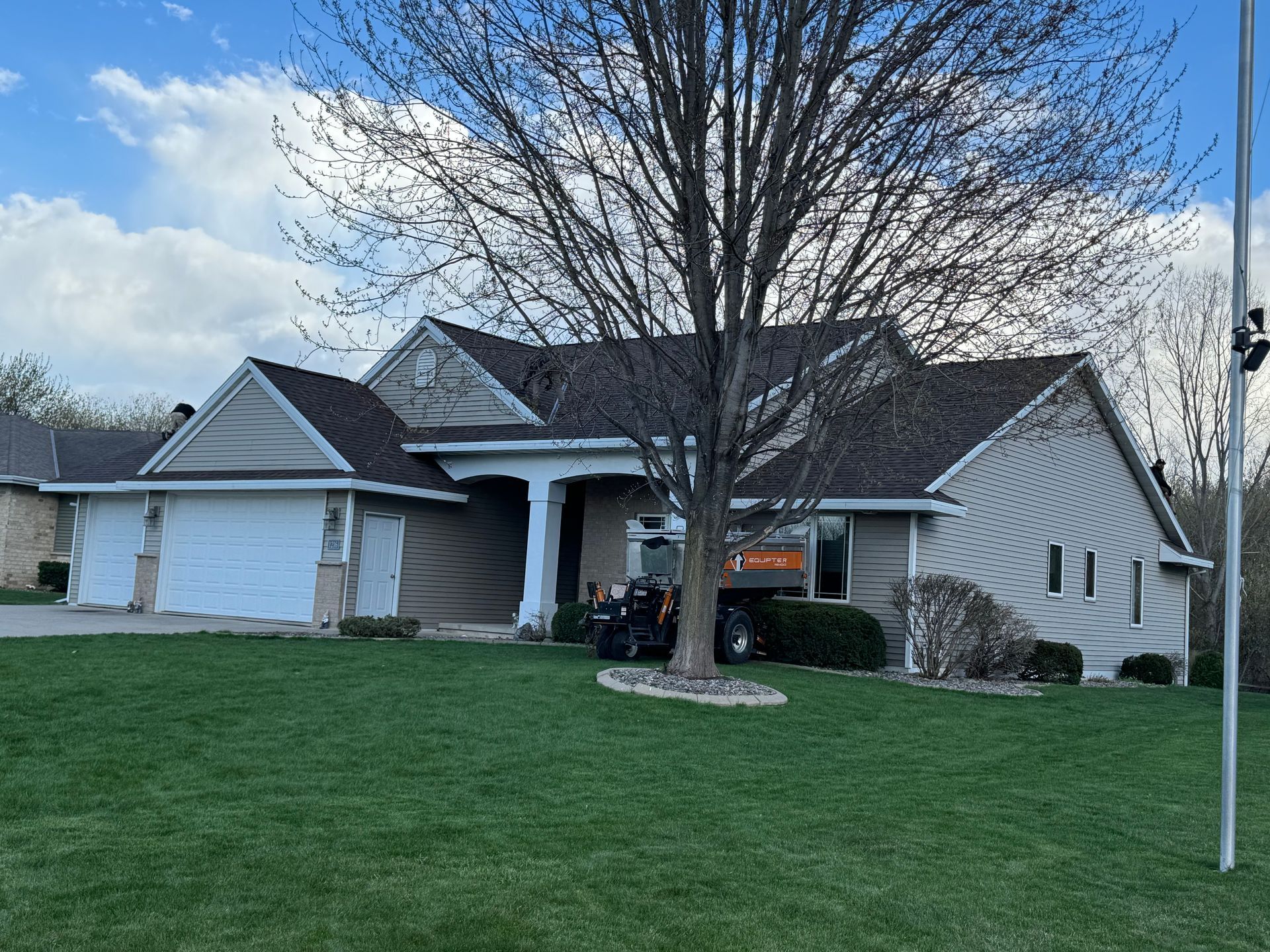 A large house with a large lawn in front of it.