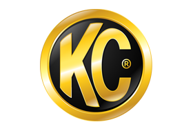 A gold and black kc logo on a white background