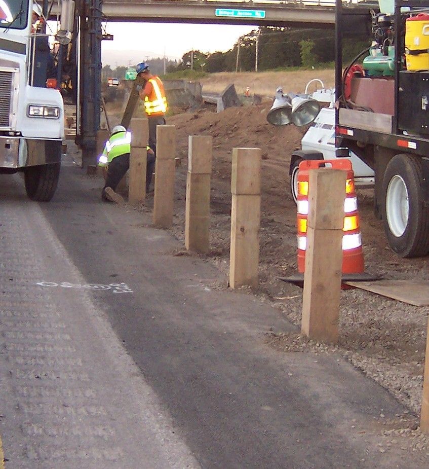 A white truck is parked on the side of the road