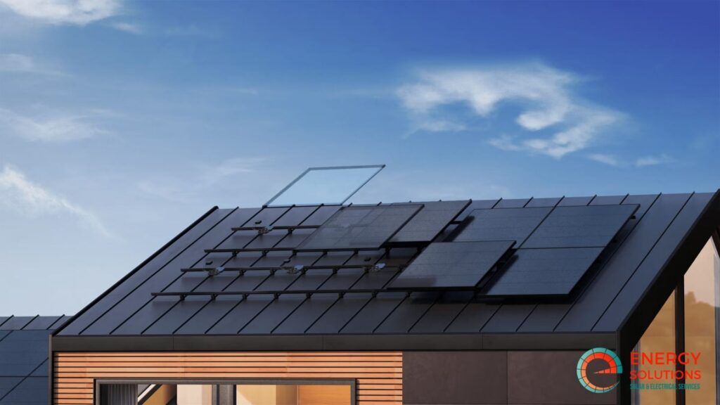 Solar panels on a dark roof under a blue sky.