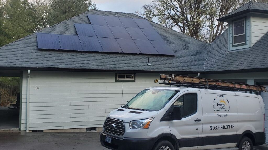home solar panels on garage with energy solution van in front