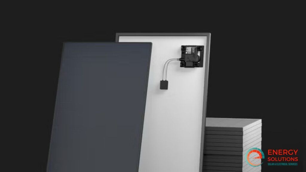 Solar panel: black front, white back with junction box and wires, stacked panels on gray background.