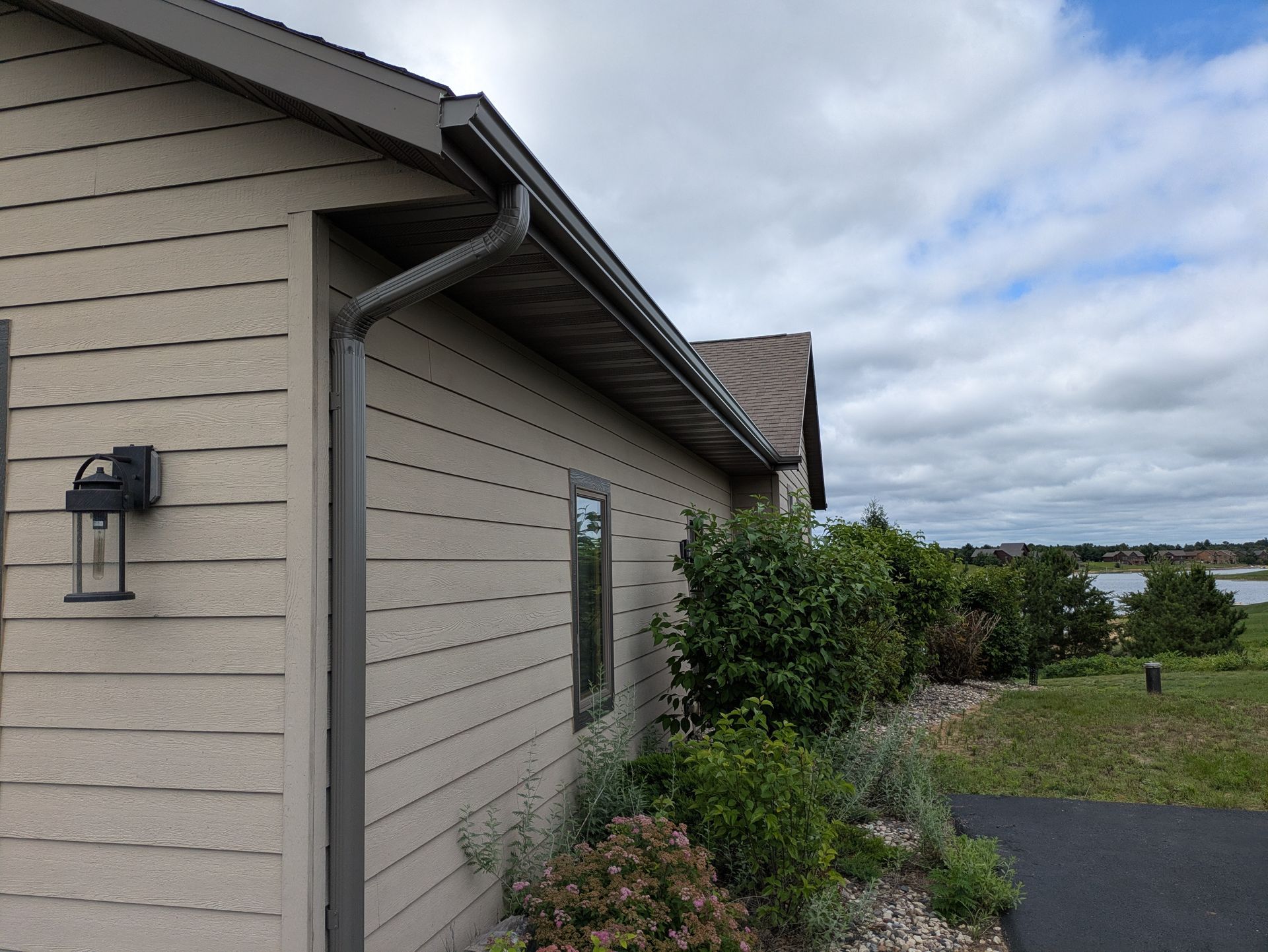 A house with a gutter on the side of it
