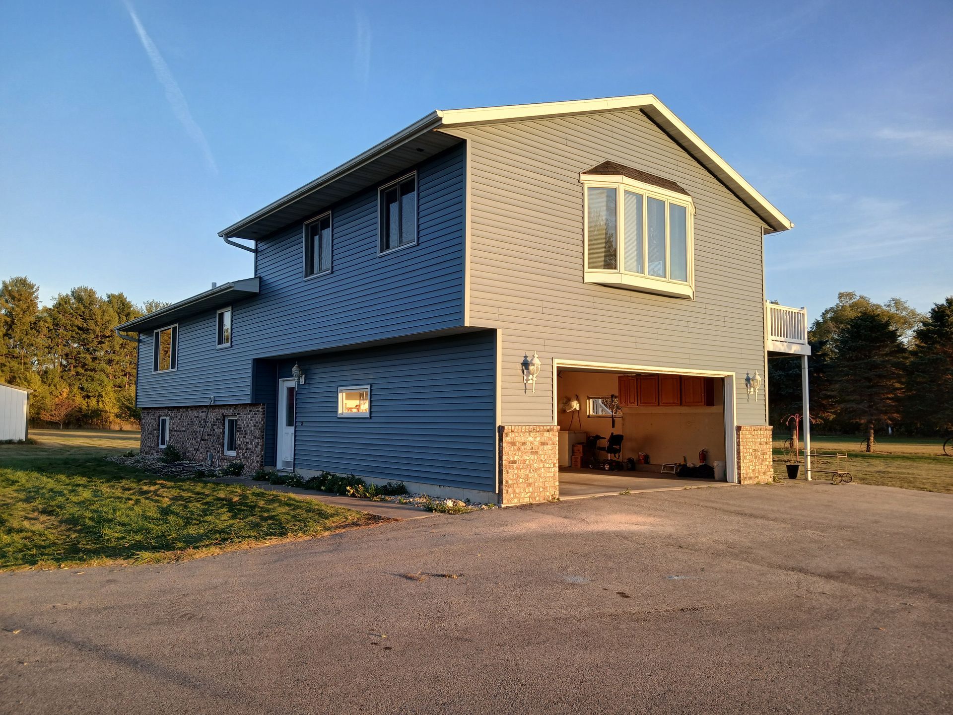 A large house with a garage and a balcony