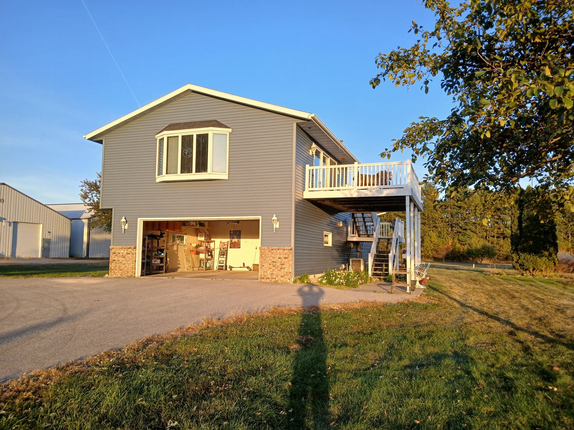 A large house with a garage and a balcony