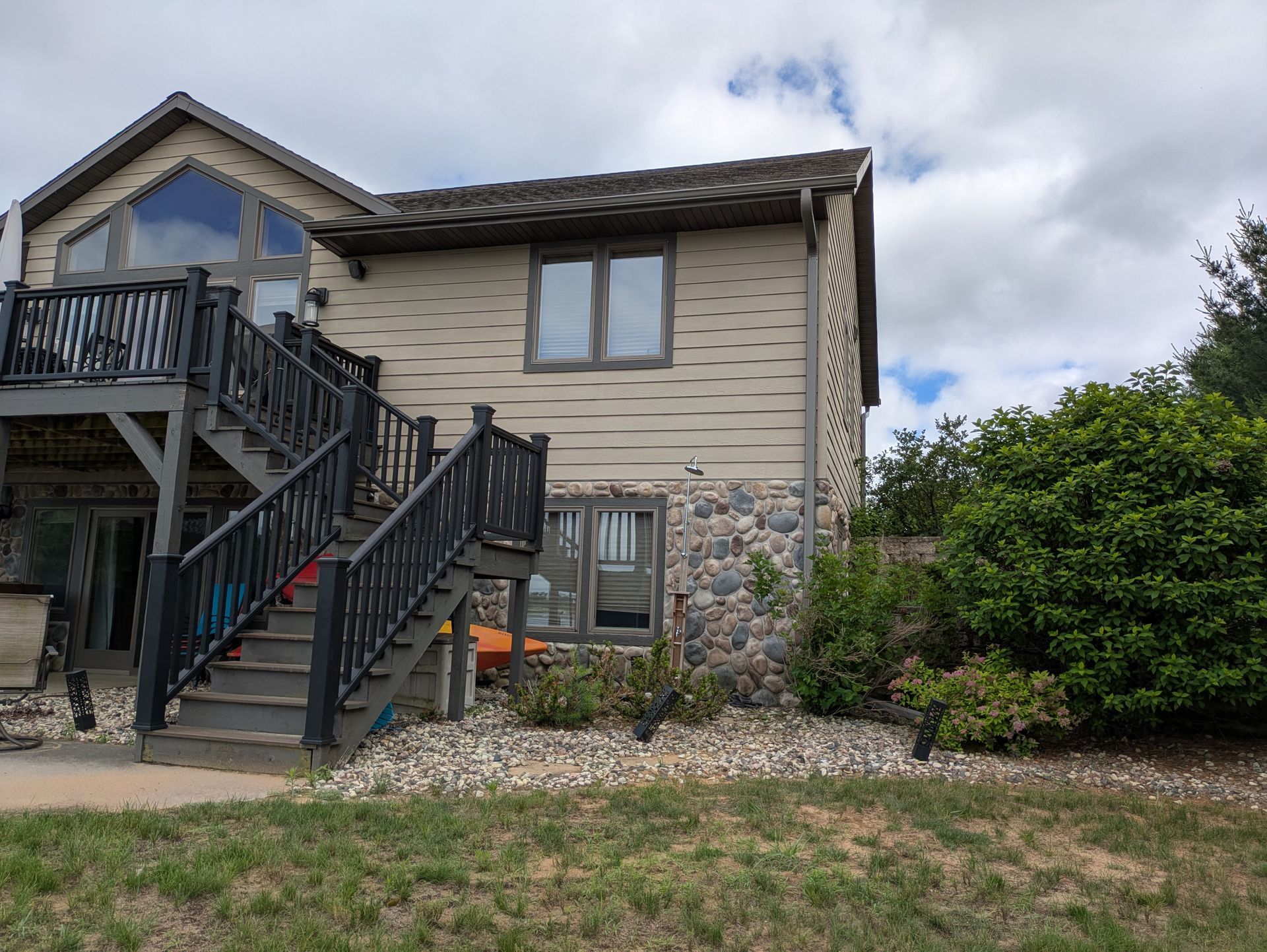 A large house with stairs leading up to the second floor