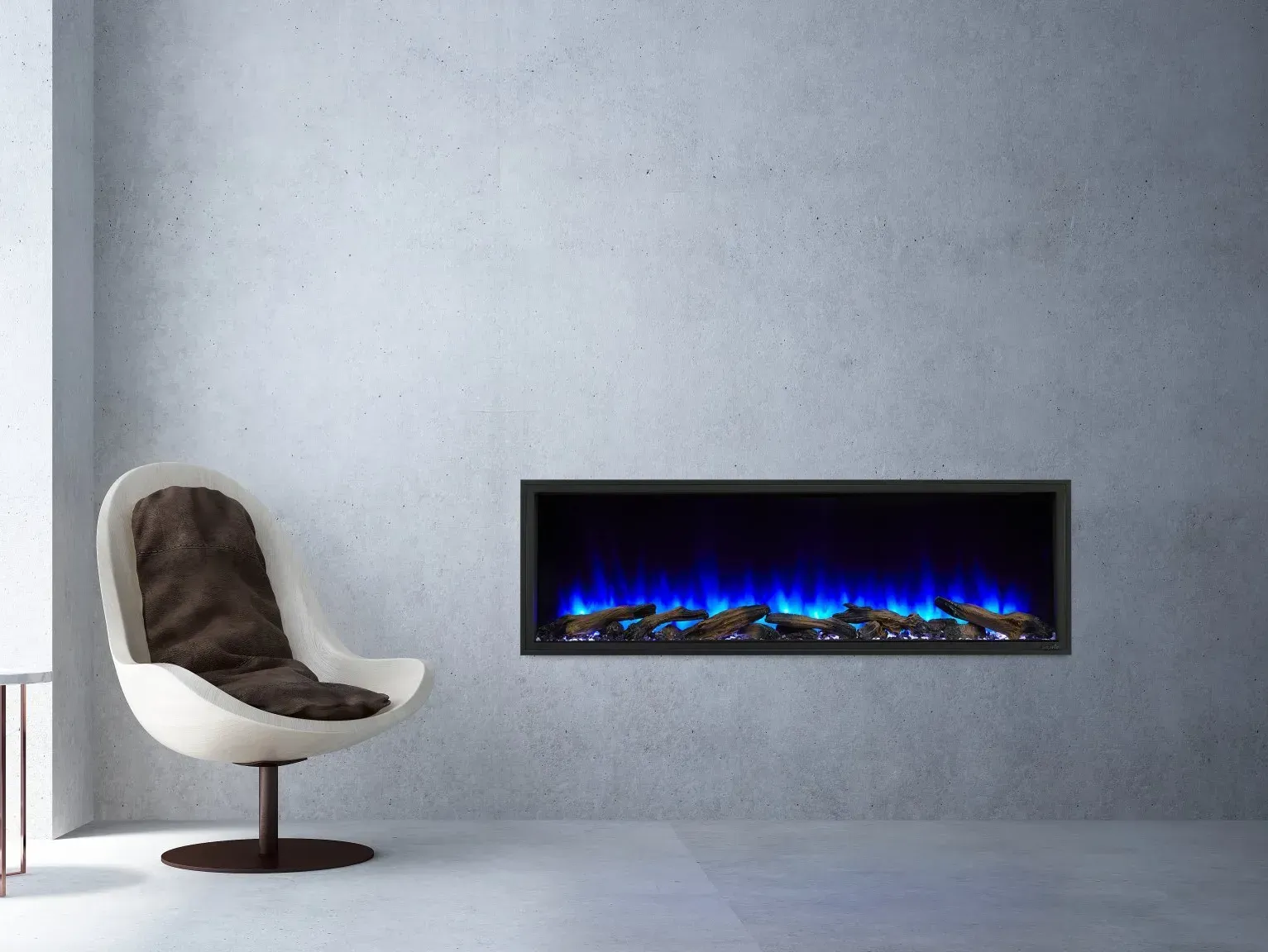 Modern living room with a wall-mounted electric fireplace and white chair. The fireplace glows blue.