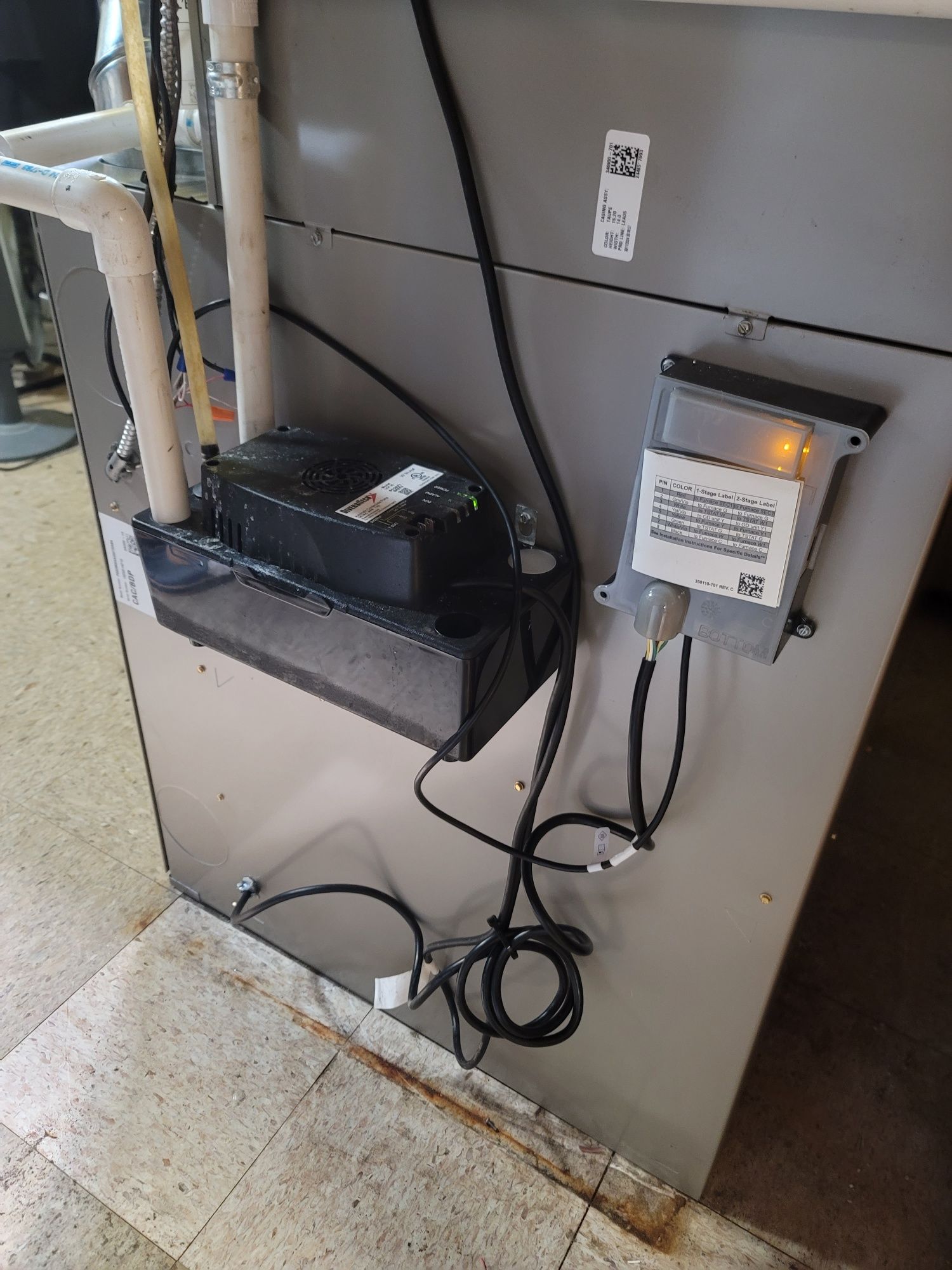 A close up of a heater with a bunch of wires coming out of it.