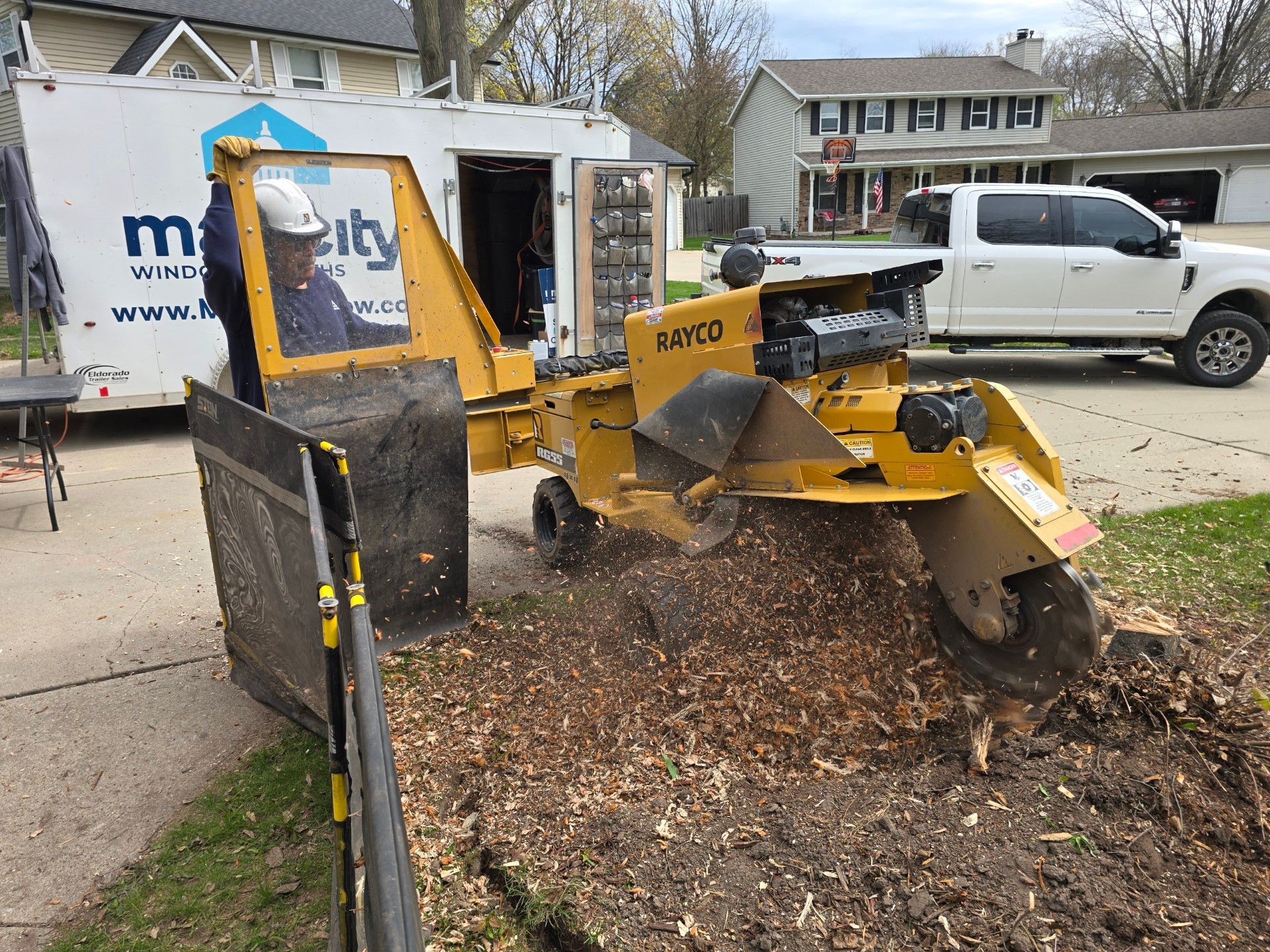 A stump grinder is being used to remove a tree stump.