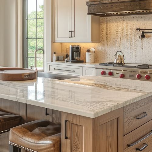 Modern kitchen with marble island, wood cabinets, stove, and coffee maker by a window