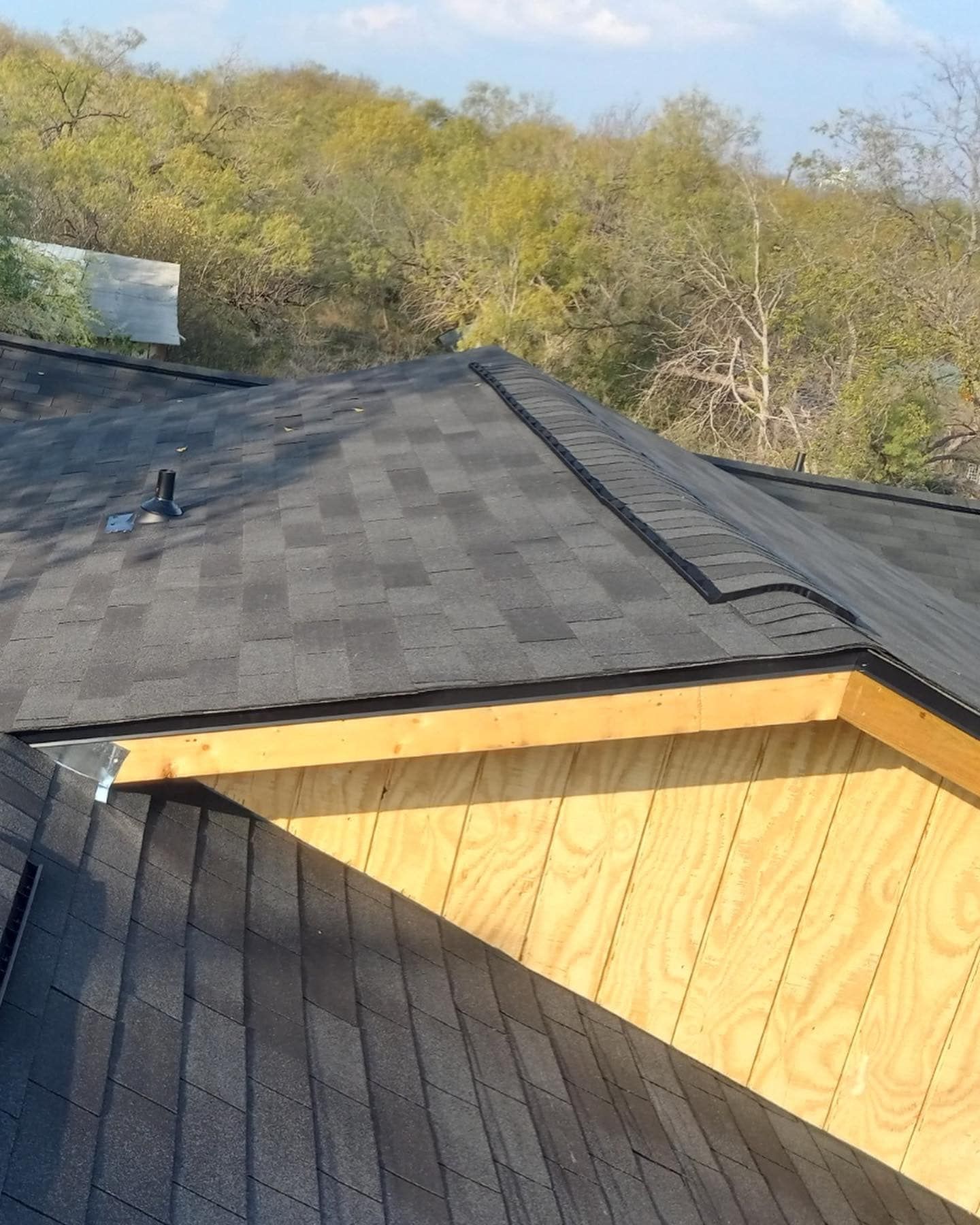 The roof of a house has shingles on it
