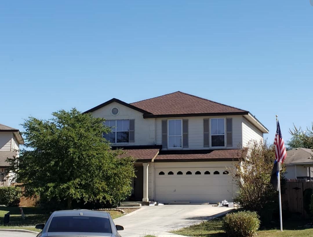 A large house with a car parked in front of it