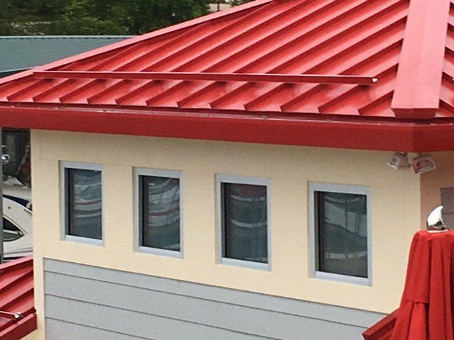 Red roof with four windows