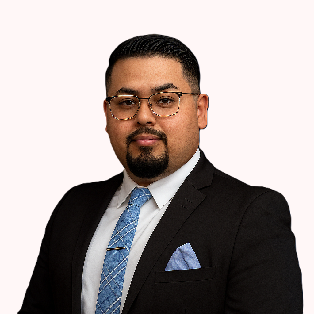 A man with a beard wearing glasses and a suit