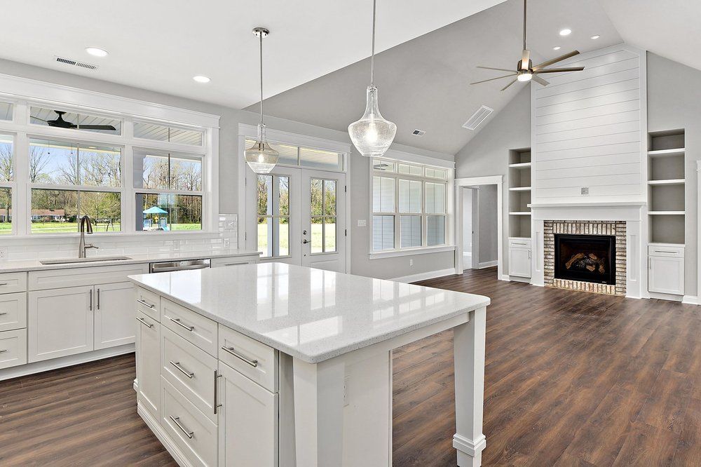 There is a large island in the middle of the kitchen.
