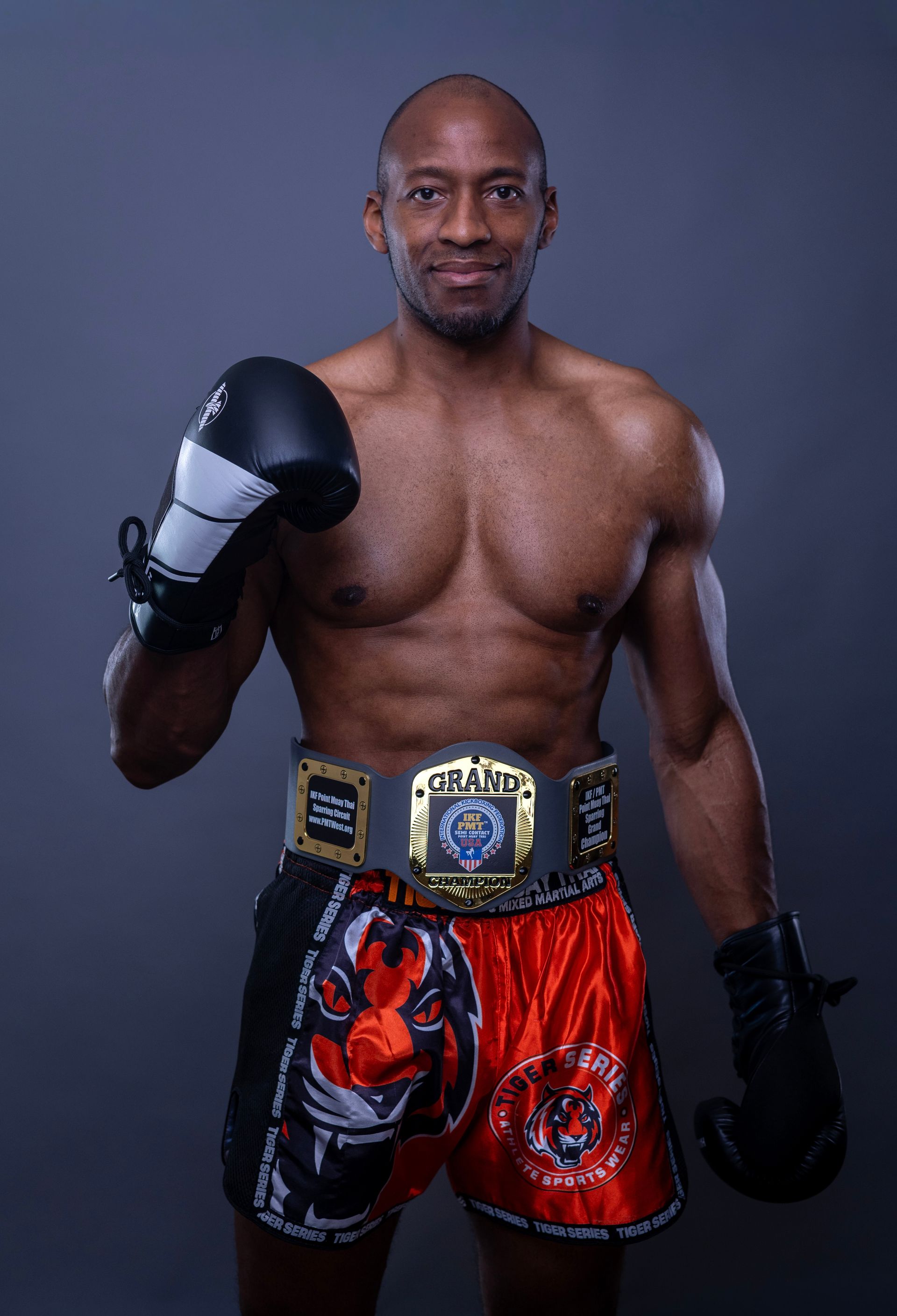 A silhouette of a man without a face on a gray background.