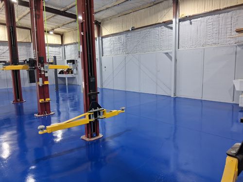 blue epoxy flooring in warehouse