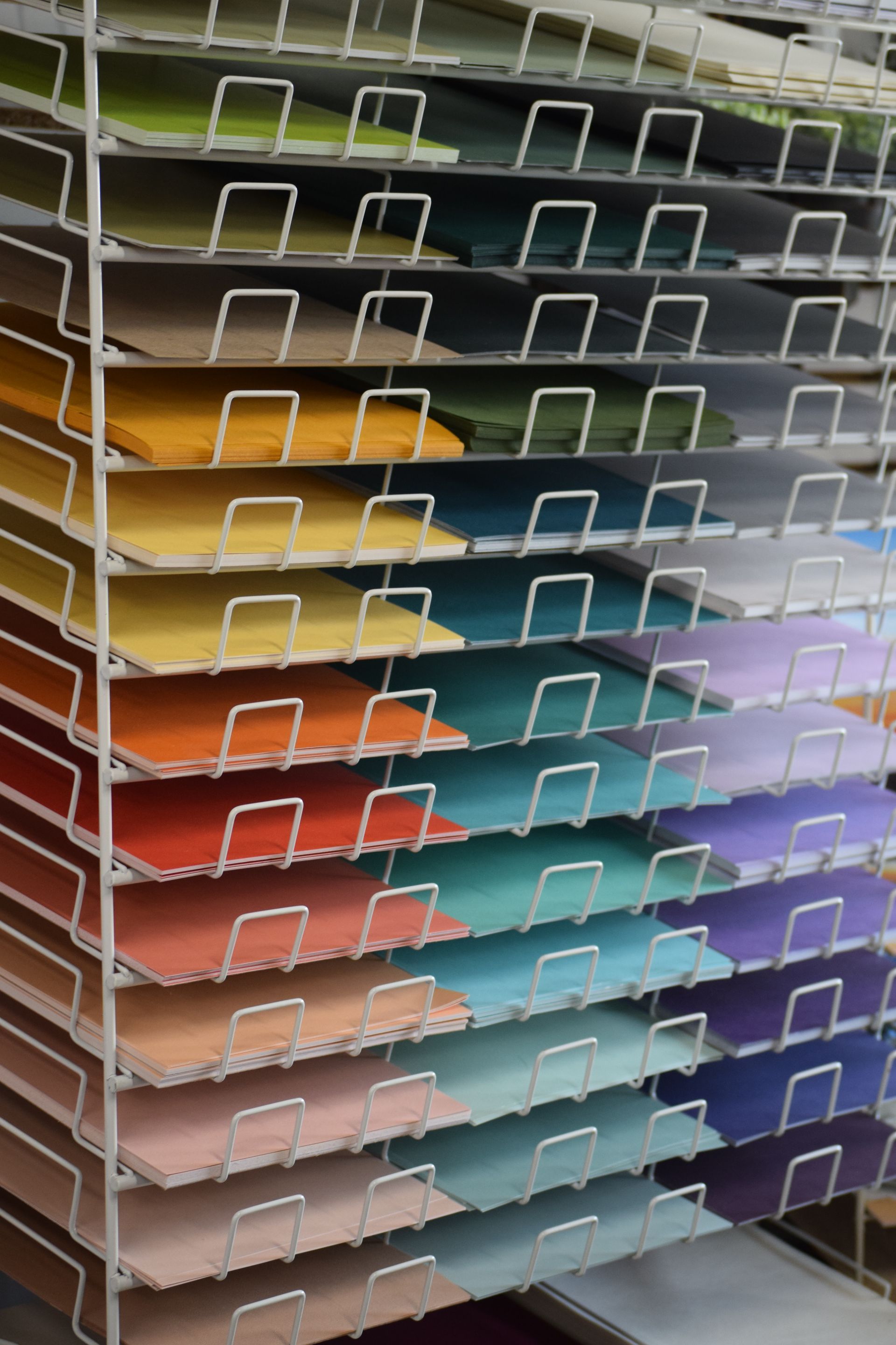 A bunch of different colored paper stacked on top of each other