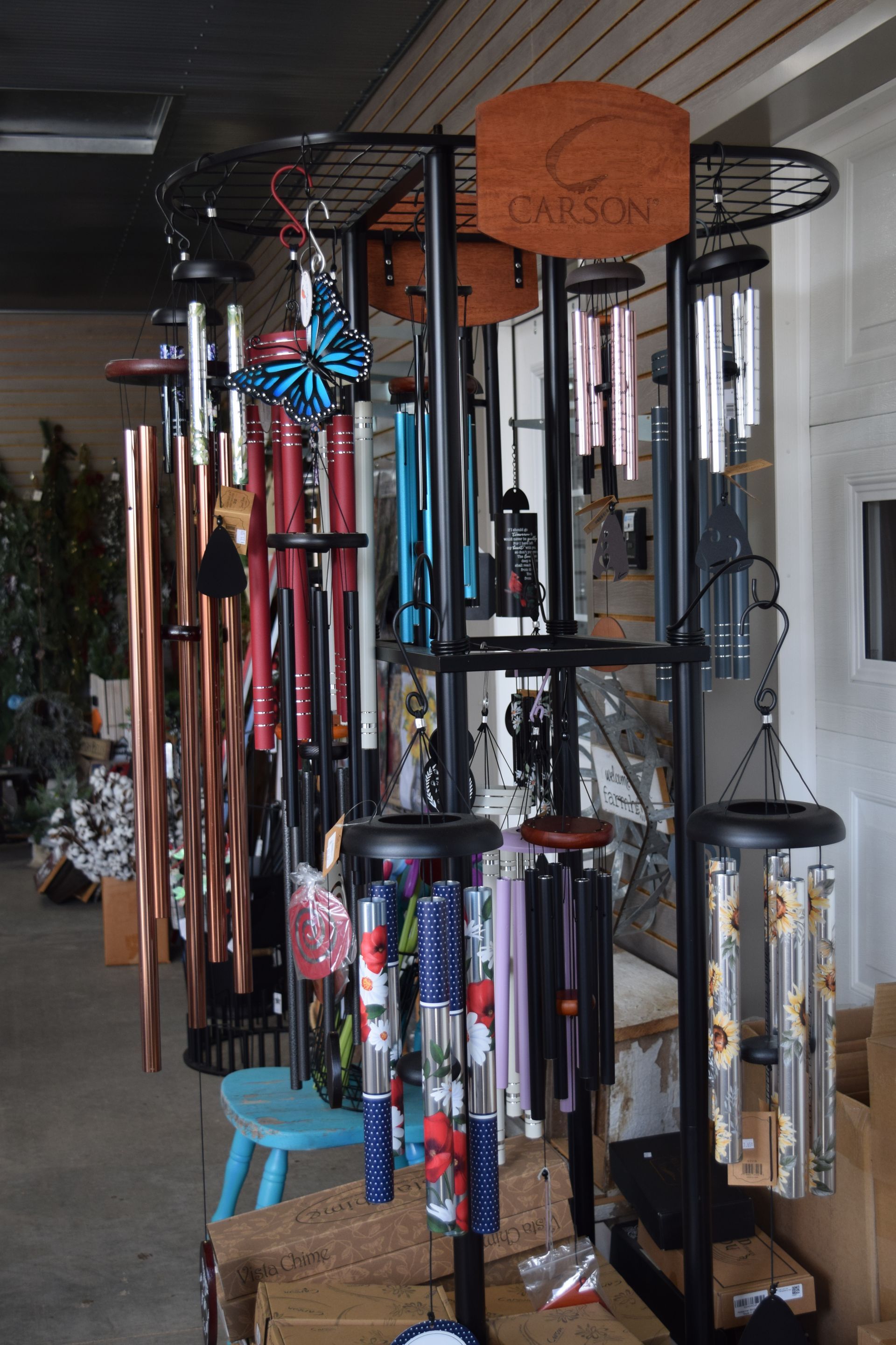 A bunch of wind chimes are on display in a store