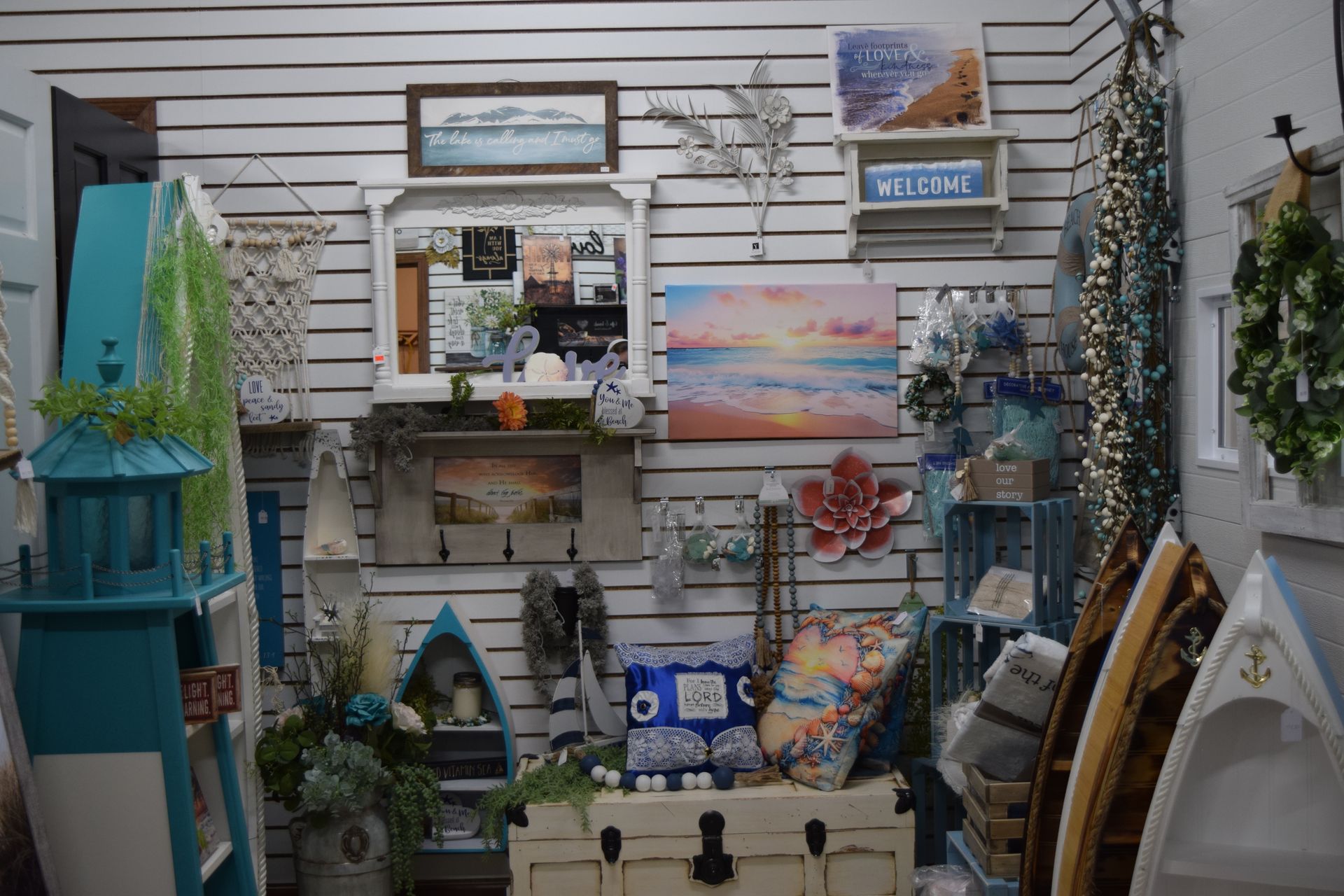 A room filled with lots of decorations and a lighthouse.