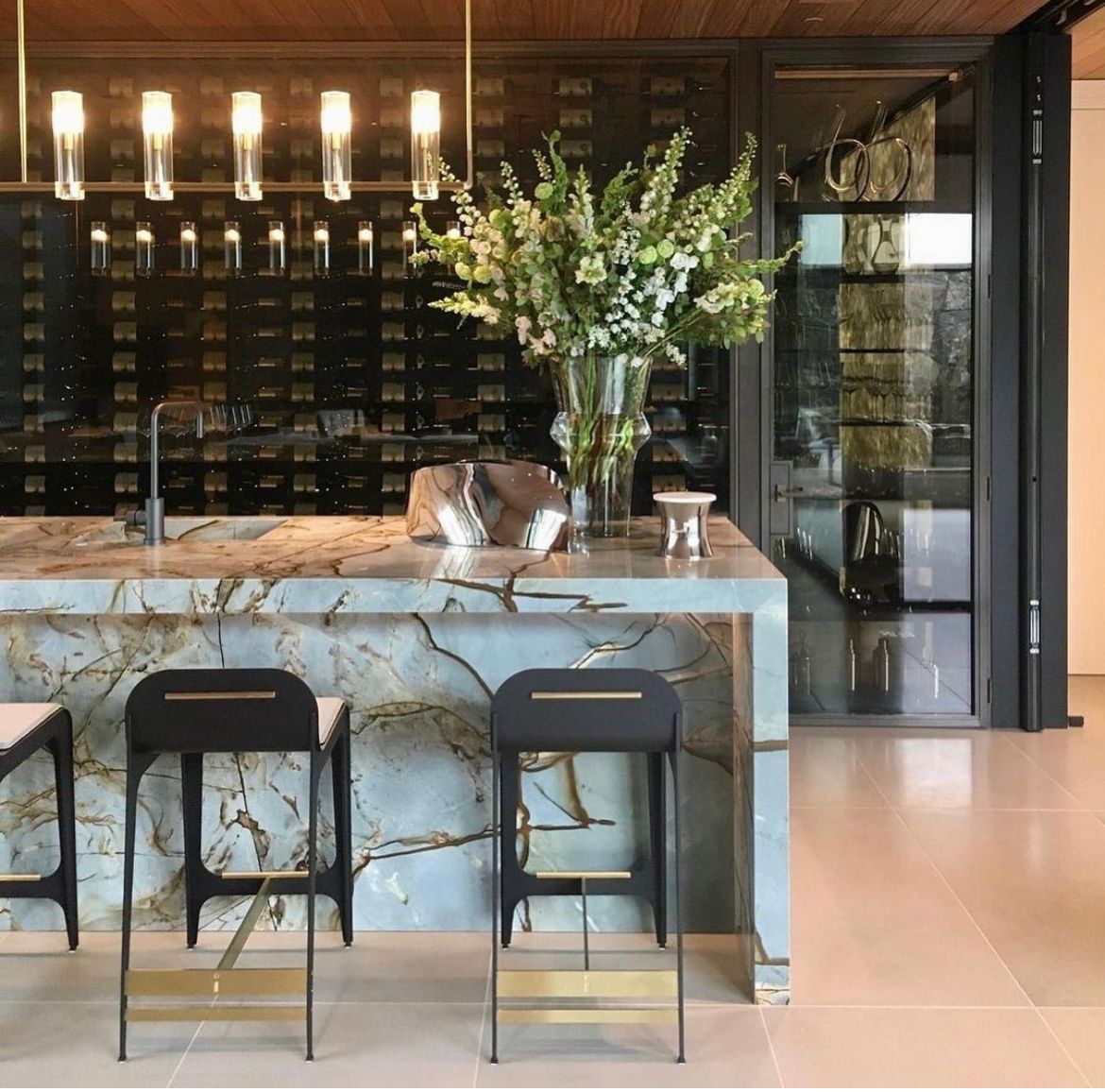 Modern bathroom with white tile and green plants and a bookshelf