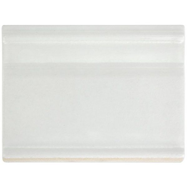 White geometric textured tile backsplash with soap dispenser and marble container.