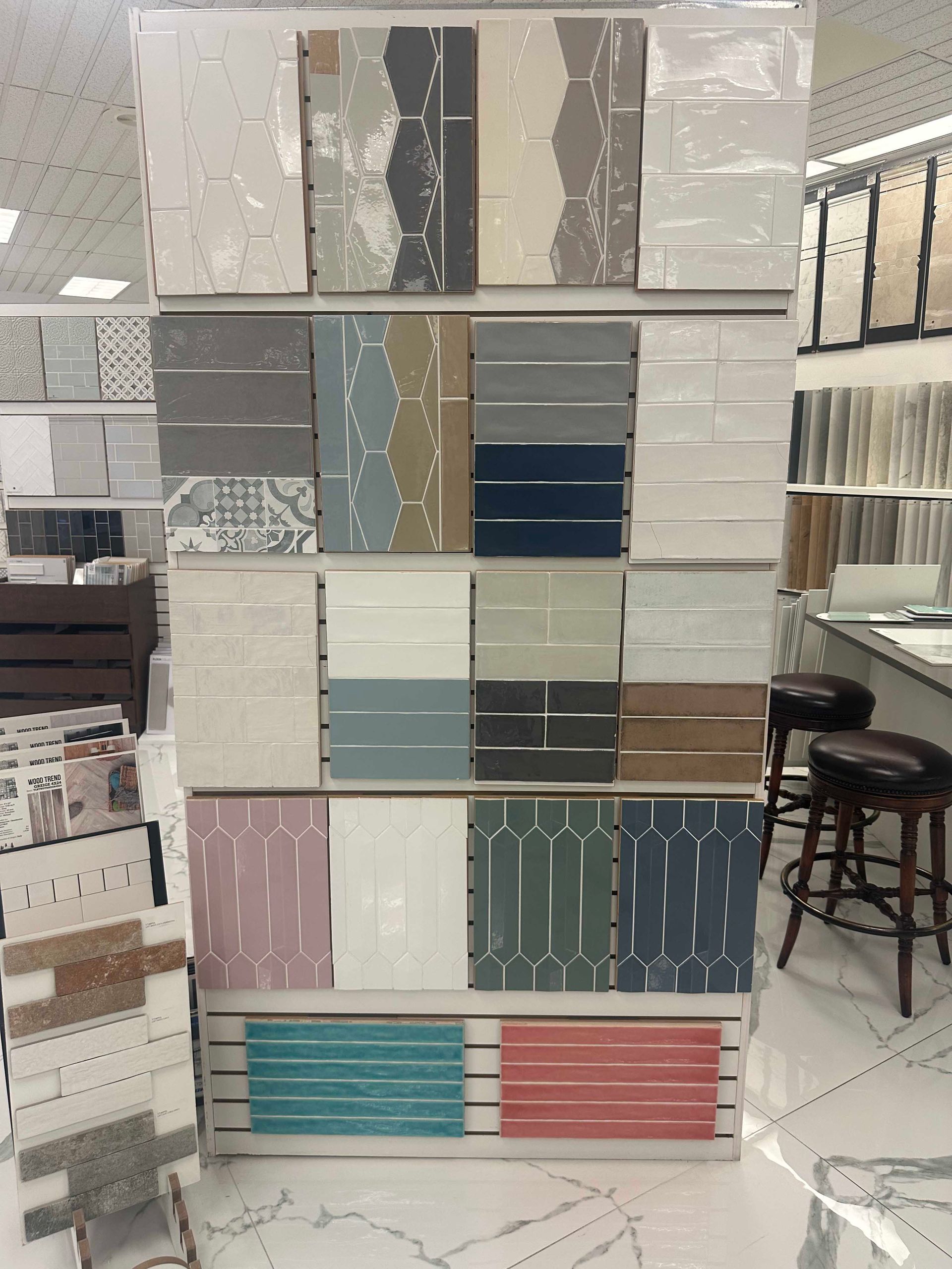 Tile display in a store, showcasing various colors and patterns.
