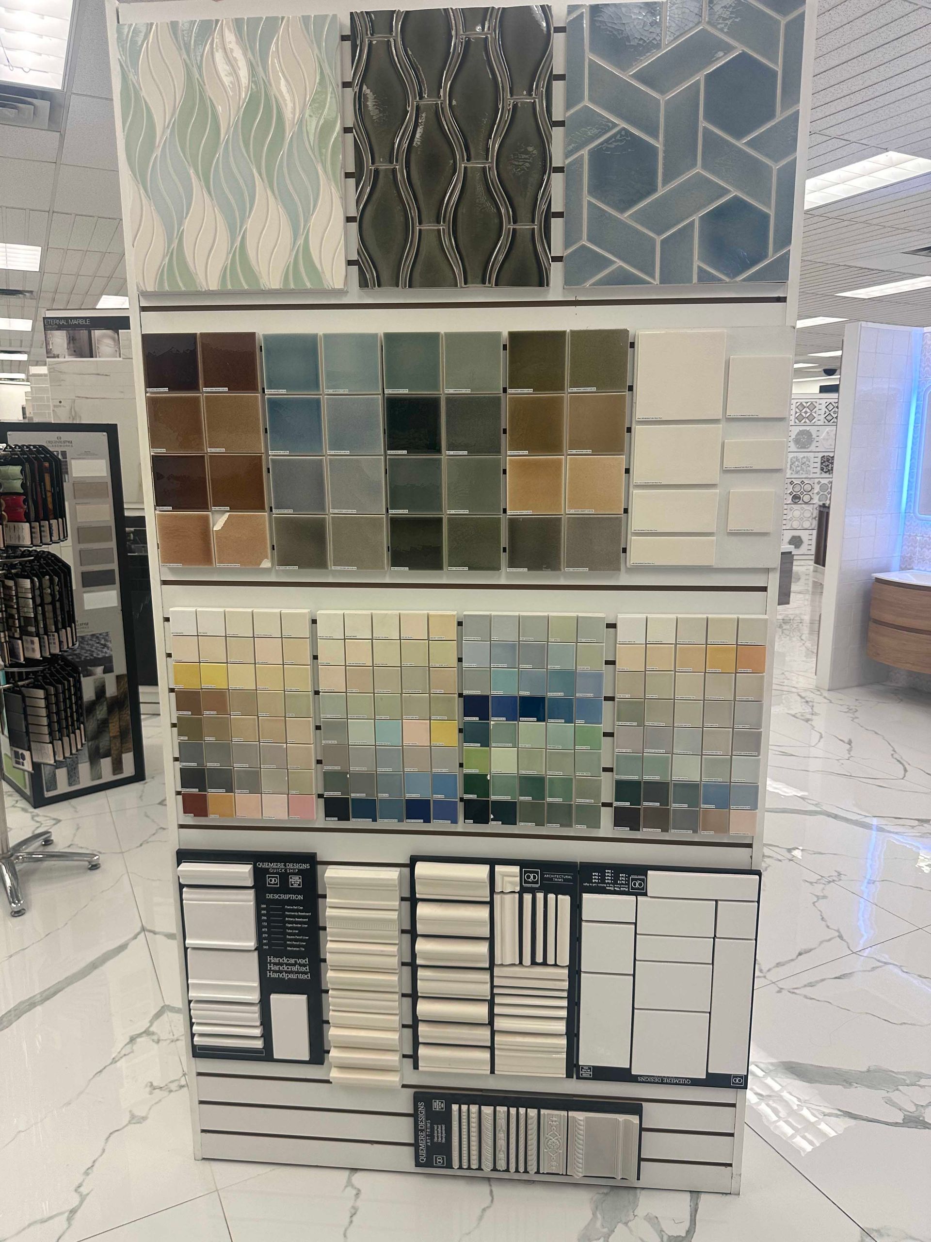 Tile display showcasing various colors and patterns in a retail store.