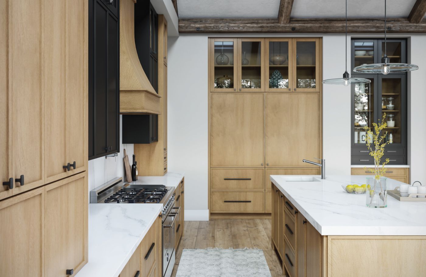 Kitchen with light wood cabinetry, white countertops, stainless steel appliances, and a central island.