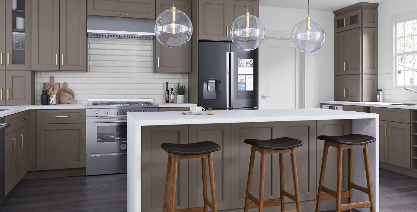 Modern kitchen with gray cabinets, white countertops, black refrigerator, and an island with bar stools.