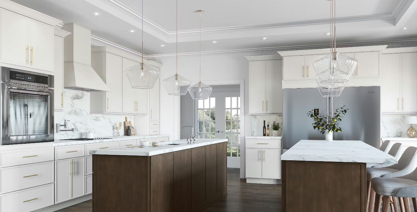 Elegant white kitchen with two brown-toned islands, white marble countertops, and stainless steel appliances.