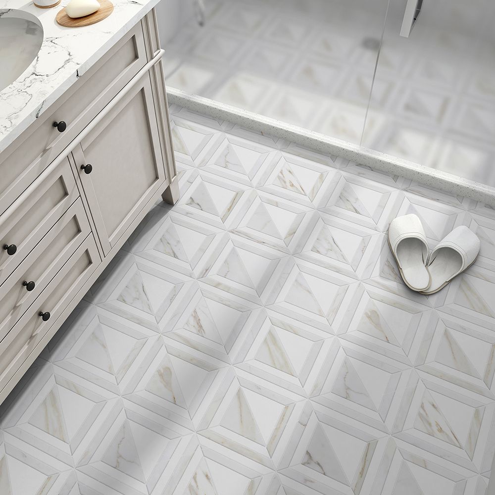 White bathroom with geometric patterned floor, vanity, and slippers.