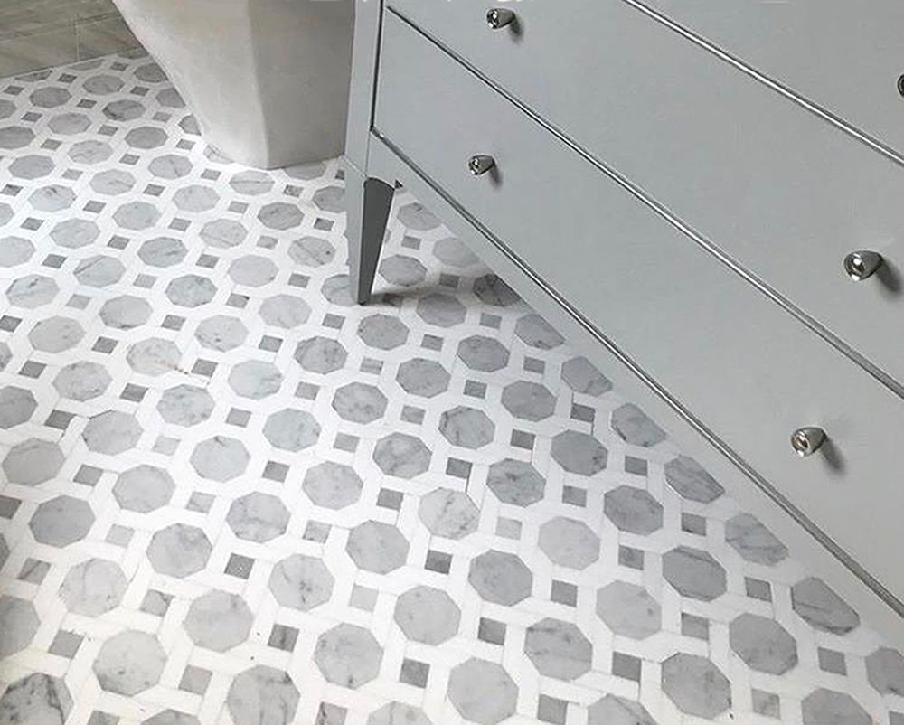 Gray dresser and white octagon patterned tile floor.