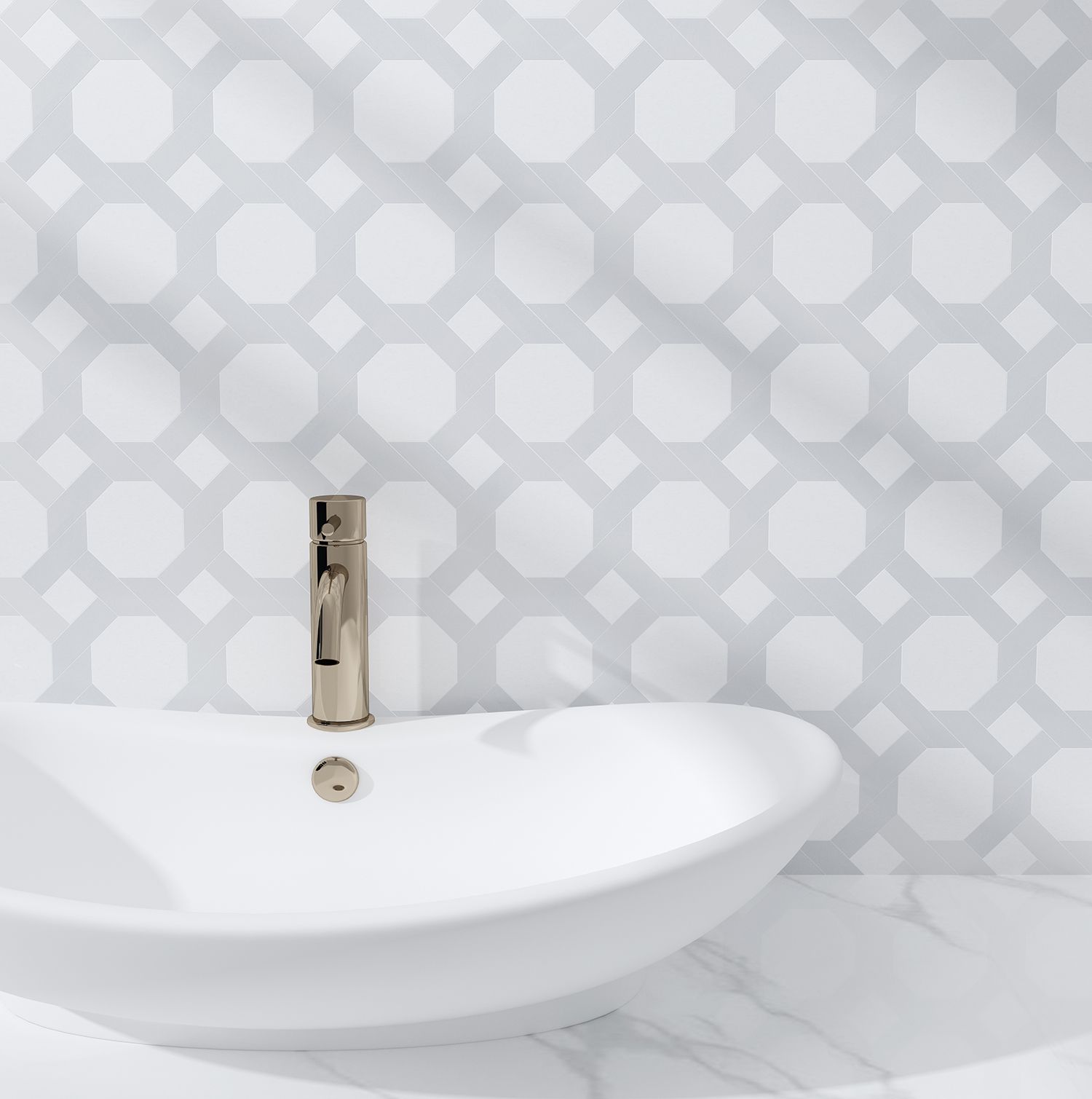 White oval sink with chrome faucet against a light gray patterned tile wall.