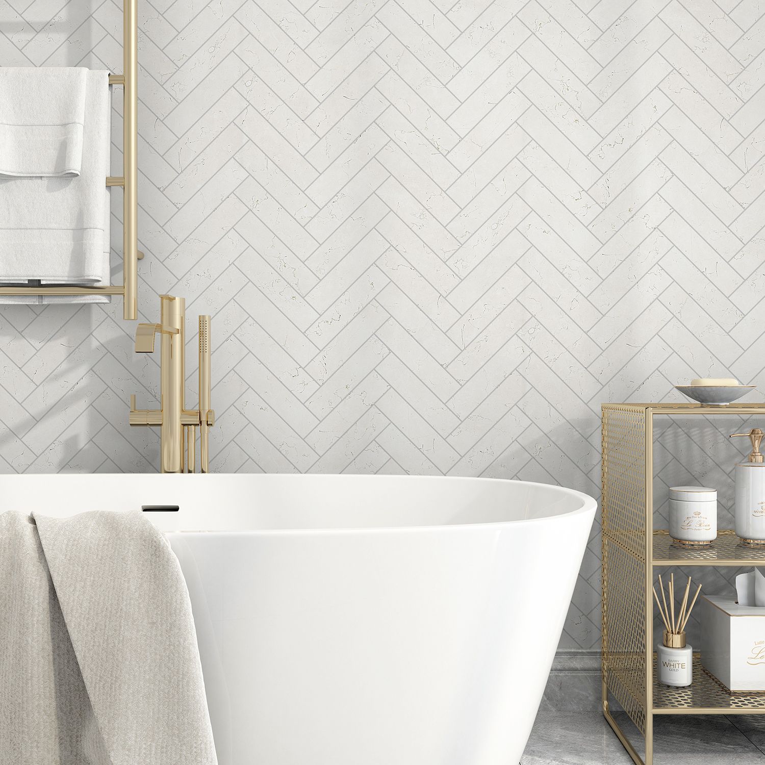 White bathtub in a modern bathroom with herringbone tile wall and gold fixtures.